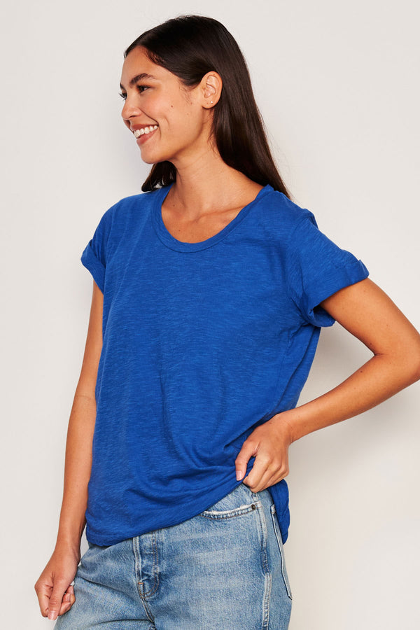 Sundry Rolled Sleeve Tee in Symphony-side view model  is looking away from camera and has her hands on her waist