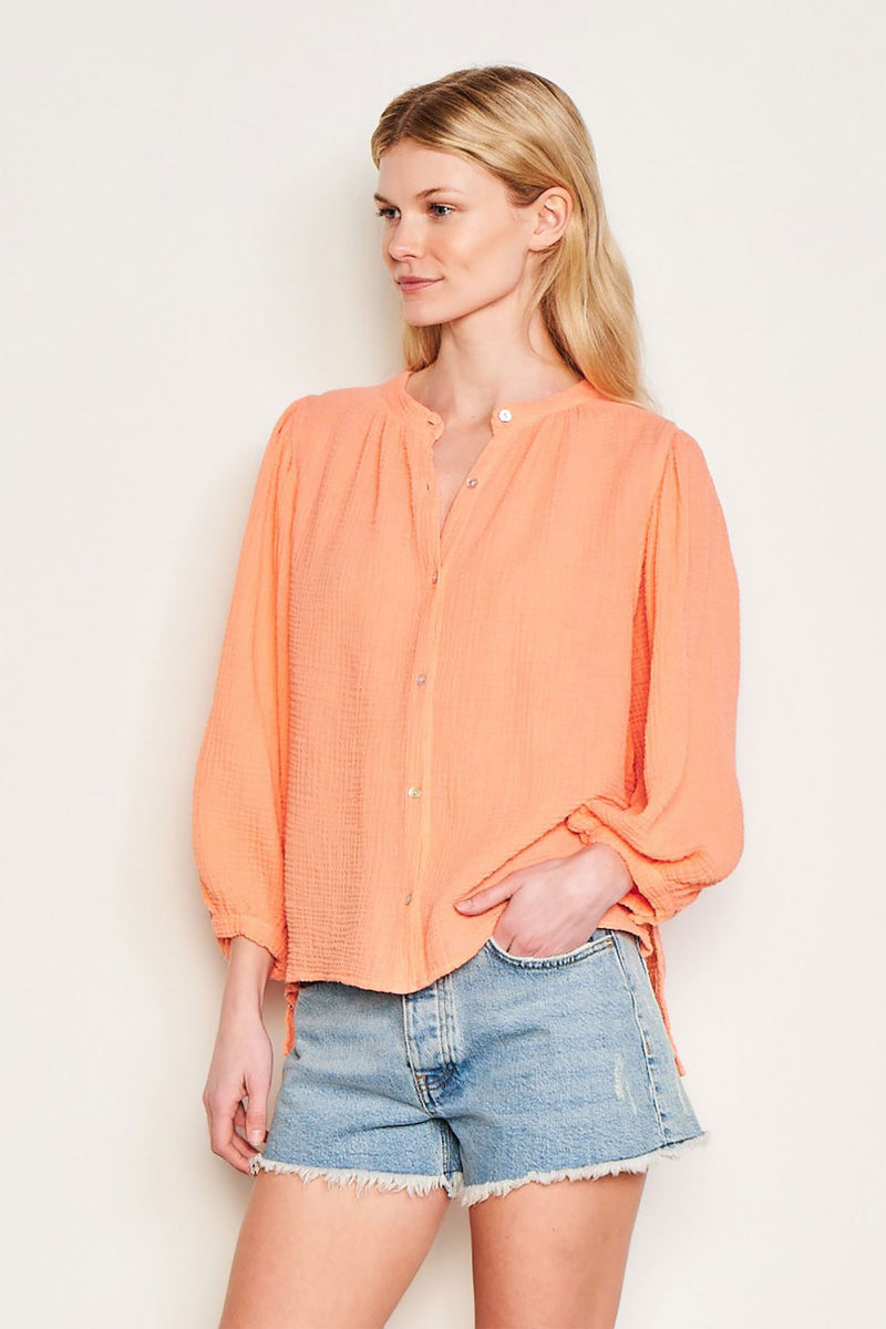 Sundry Free Spirit Shirt in Pink-3/4 model is looking off to the side and has her hands in her pocket 