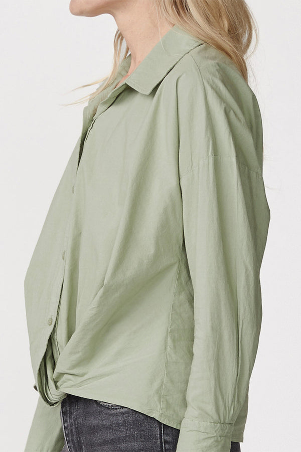 Voile Long Sleeve Front Twist Shirt in Fern-clos eup side view of twsit