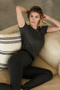 Pfeiffer Pant in Anthracite- sitting on couch - side view